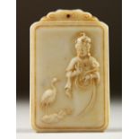 A CARVED WHITE JADE PENDANT, decorated with Guanyin and calligraphy. 7cms high.