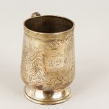 A VICTORIAN SILVER CHRISTENING MUG, with engraved decoration. 9cms high.