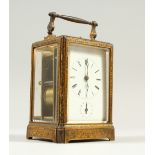 A GOOD 19TH CENTURY FRENCH BRASS REPEATER ALARM CARRIAGE CLOCK, in an ornate case. 14cms high.