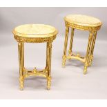 A PAIR OF FRENCH STYLE OVAL GILTWOOD TABLE, with marble inset tops. 50cm wide x 73cm high.