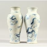 A PAIR OF BLUE AND WHITE BALUSTER SHAPED VASES, decorated with crayfish. 25cms high.