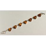 A SILVER AND TIGERS EYE BRACELET.