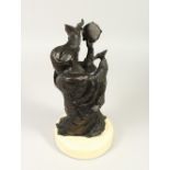 ANNE ROONEY (20TH CENTURY) AMERICAN A BRONZE MASKED FEMALE FIGURE, holding a tambourine, on a