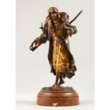 A SUPERB AUSTRIAN COLD CAST PAINTED BRONZE OF AN ARAB, carrying a deer over his shoulders by FRANZ