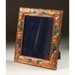 A COPPER AND ENAMEL UPRIGHT PHOTOGRAPH FRAME. 33cms high x 27cms wide.