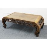 A GOOD 19TH CENTURY CHINESE HARDWOOD OPIUM / LOW TABLE, with curving sides met by a carved and