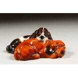 A ROYAL DOULTON COCKER SPANIEL ASLEEP, HN2590.