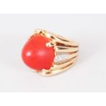 AN 18CT GOLD, CORAL AND DIAMOND RING.