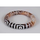 A TIBETAN AGATE BANGLE. 8cms.