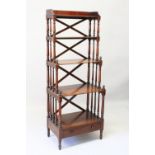 A TALL LATE REGENCY MAHOGANY FOUR TIER WHAT-NOT, with cross frame back, turned supports, single