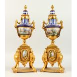 A GOOD PAIR OF 19TH CENTURY FRENCH "SEVRES" GILT METAL AND PORCELAIN URN SHAPED SIDE PIECES. 38cms