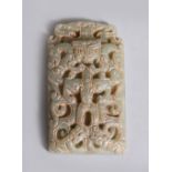 A CARVED AND PIERCED JADE PENDANT. 7cms high.
