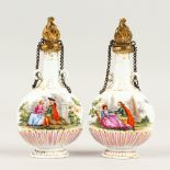 A GOOD SMALL PAIR OF MEISSEN PORCELAIN PIGRIM SHAPED SCENT BOTTLES with gilt metal stoppers. Cross