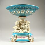 A MEISSEN STYLE CIRCULAR COMPORT, with cherub support. 30cms high.