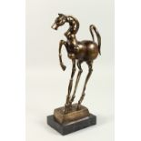 AFTER S. DALI (1904-1989) SPANISH A PRANCING BRONZE HORSE. Signed Dali. 30cms high, on a marble