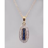 A 9CT GOLD CALIBRE CUT SAPPHIRE AND DIAMOND DECO STYLE PENDANT AND CHAIN.