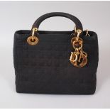 A VERY GOOD CHRISTIAN DIOR BLACK BAG, with gilt mounts.