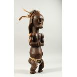 A GOOD TRIBAL CARVED WOOD STANDING FEMALE FIGURE. 43cms high.