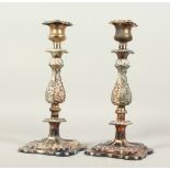 A GOOD PAIR OF PLATED CANDLESTICKS, on square bases. 30cms high.