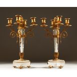 A PAIR OF ROCK CRYSTAL AND ORMOLU FOUR BRANCH CANDELABRA. 38cms high.