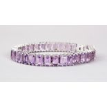 A VERY GOD SILVER SQUARE CUT AMETHYST LINE BRACELET.