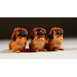 THREE ROYAL DOULTON PORCELAIN MODELS OF PEKINGESE.