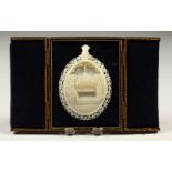 A GOOD CARVED MOTHER-OF-PEARL OVAL PLAQUE, depicting The Last Supper, in a fitted leather case.