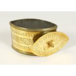 A REGENCY "NAVETTE STYLE" ENGRAVED BRASS TEA CADDY AND COVER. 18cms long.