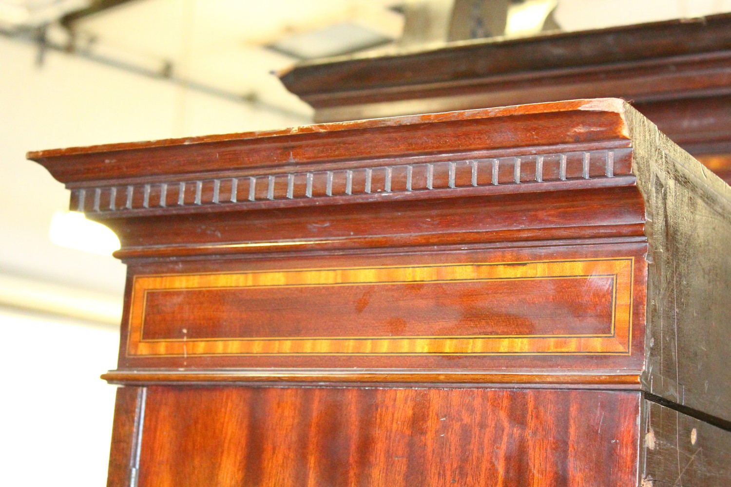 AN EDWARDIAN MAHOGANY BREAKFRONT STANDING BOOKCASE, the top with swan neck pediment, over four glass - Image 10 of 11