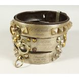 THREE 18TH CENTURY FRENCH LEATHER, METAL MOUNTED AND STUDDED DOG COLLARS, with inscription and