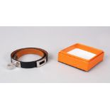 A HERMES LEATHER BRACELET, in a Hermes box.