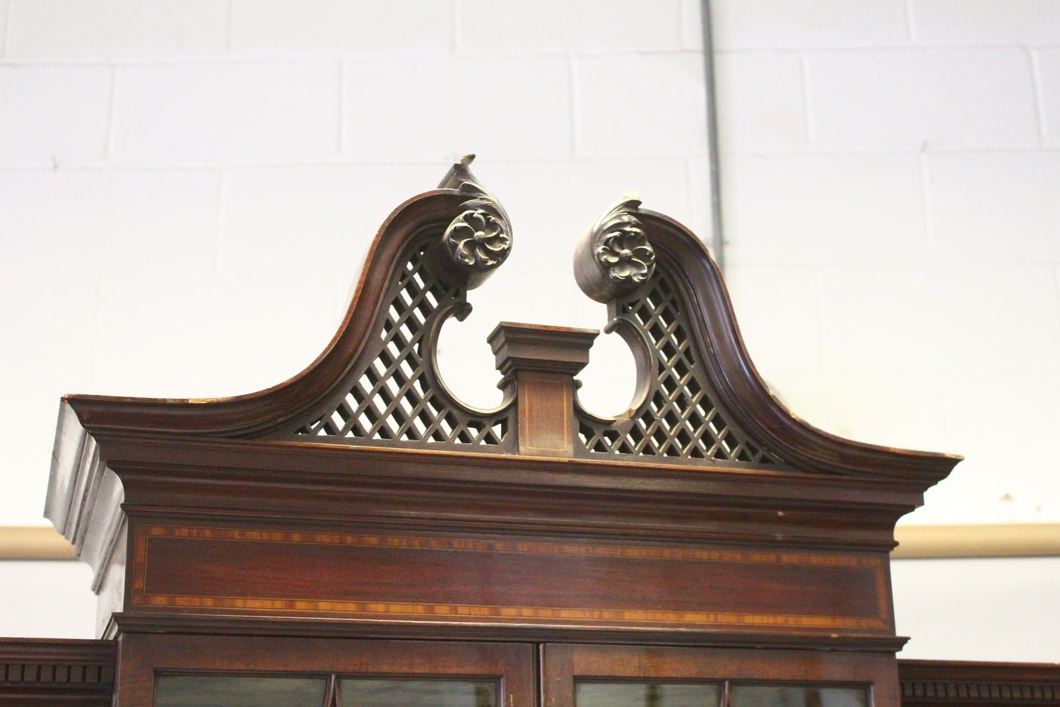 AN EDWARDIAN MAHOGANY BREAKFRONT STANDING BOOKCASE, the top with swan neck pediment, over four glass - Image 2 of 11