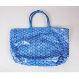 A BLUE E. GOYARD BAG.