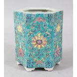 A CHINESE TURQUOISE GROUND HEXAGONAL BRUSH POT, with enamelled decoration. 14cms high.