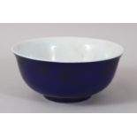 A CHINESE CIRCULAR PORCELAIN BOWL, with bright blue glaze. 13cms diameter.