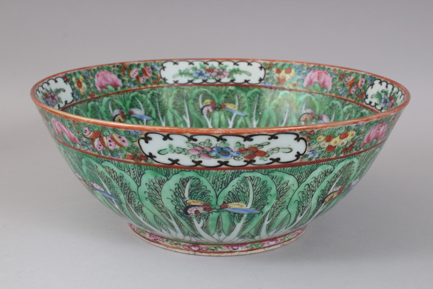 AN EARLY 20TH CENTURY CHINESE CANTON BUTTERFLY AND CABBAGE LEAF BOWL. 31cms diameter. - Image 2 of 7