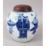 AN 18TH CENTURY CHINESE BLUE AND WHITE GINGER JAR AND WOODEN COVER, the sides decorated with vases