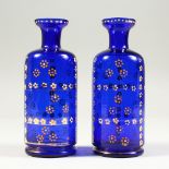 A PAIR OF BRISTOL BLUE BOTTLES. 14cms high.