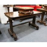 A GOOD REGENCY ROSEWOOD LIBRARY TABLE, with rounded rectangular top, column supports united by a