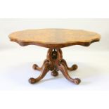 A GOOD VICTORIAN FIGURED WALNUT SHAPED TOP LOO TABLE, with open work quadruple curving supports