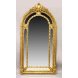 A LARGE AND IMPRESSIVE GILT FRAMED MIRROR.