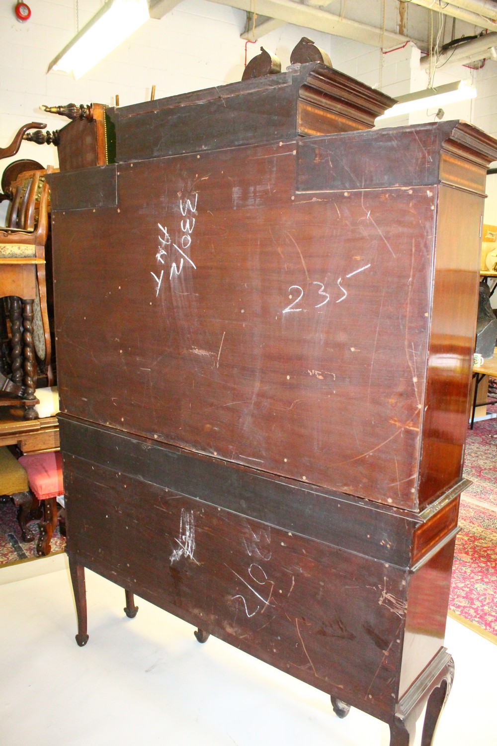 AN EDWARDIAN MAHOGANY BREAKFRONT STANDING BOOKCASE, the top with swan neck pediment, over four glass - Image 9 of 11