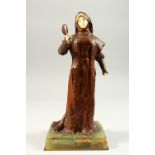 LOUIS OUVET (D. 1920) FRENCH AN ART DECO GILDED BRONZE AND IVORY FIGURE OF A LADY holding a hand