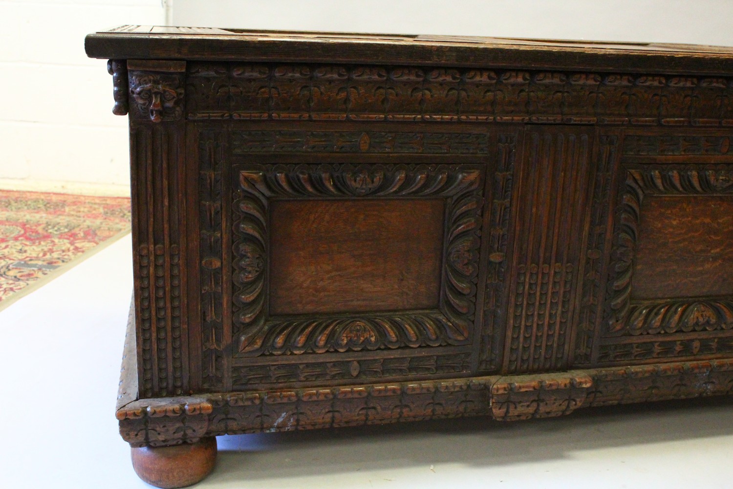 A LARGE 17TH-18TH CENTURY FRENCH OAK COFFER, with two plain panels to the top and two carved - Image 3 of 13