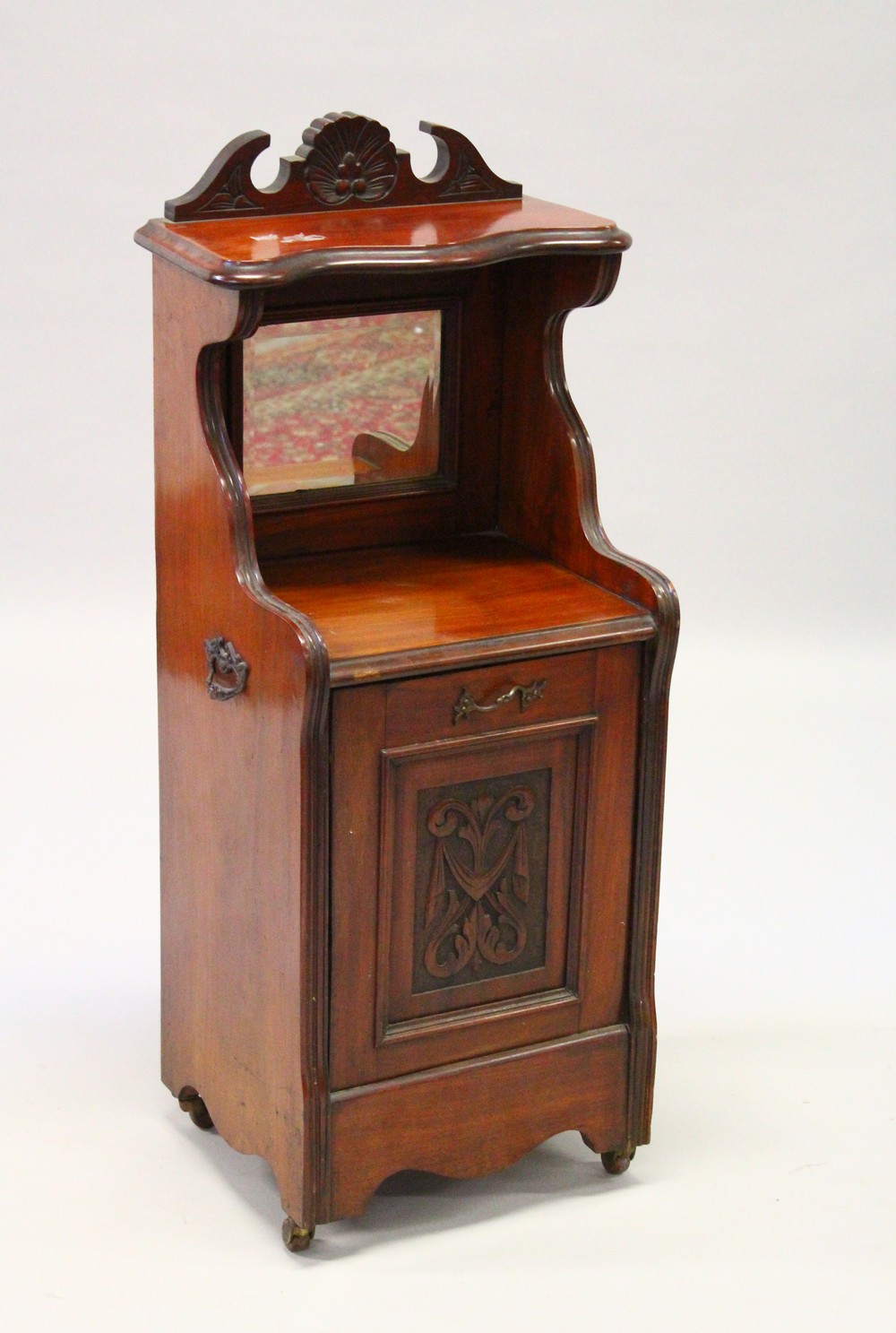 A VICTORIAN MAHOGANY COAL BOX with mirrored back and fall front. 99cms high x 42cms wide.