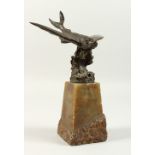 A SUPERB BRONZE OF A FLYING FISH, on a carved marble plinth. 30cms high overall.