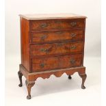 AN 18TH CENTURY WALNUT CHEST ON STAND, with crossbanded top, four long graduated drawers, with brass