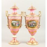 A SUPERB PAIR OF 19TH CENTURY FRENCH "SEVRES" TWO-HANDLED URNS AND COVERS, rose pompadour ground and