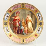 A VIENNA CIRCULAR PORCELAIN PLATE "ACHILLES UND ULYSSES", painted with vignettes and gold border.