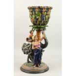 AN AUSTRIAN G. & S. MAJOLICA CIRCULAR JARDINIERE ON STAND, with fruiting vines. 23cms diameter.